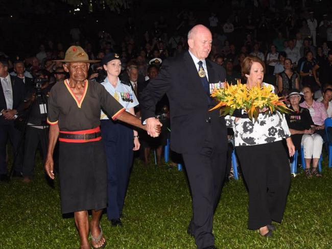 Sir Peter Cosgrove lays a wreath with one of the last surviving Fuzzy Wuzzy Angels Havala Lavla. Picture: Justin Lees