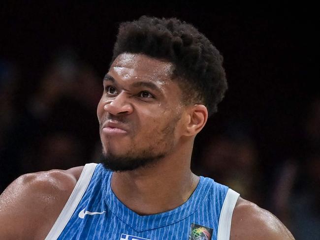 Greeceâs Giannis Antetokoumpo celebrates the win at the end of the final game of the FIBA Olympic Qualifying Tournament between Croatia and Greece at the Peace and Friendship Stadium in Athens on July 7, 2024. (Photo by Aris MESSINIS / AFP)