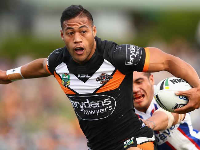 Tim Simona on the charge for the Tigers.