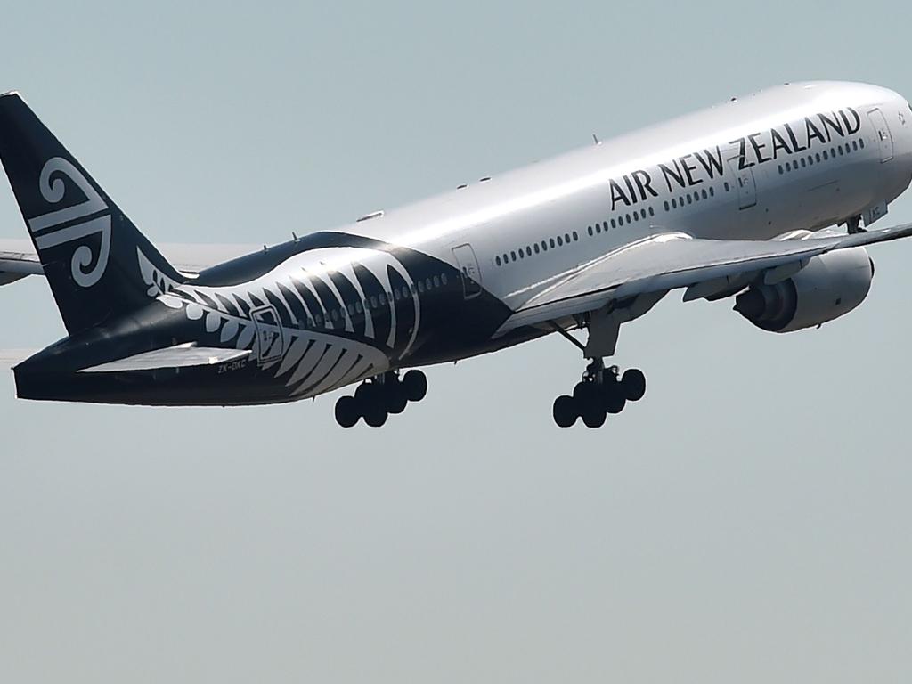 An Air New Zealand plane takes off from the airport in Sydney on August 23, 2017. Air New Zealand posted a 17.5 percent fall in annual net profit on August 23 as increased competition hit the carrier's bottom line. / AFP PHOTO / Peter PARKS