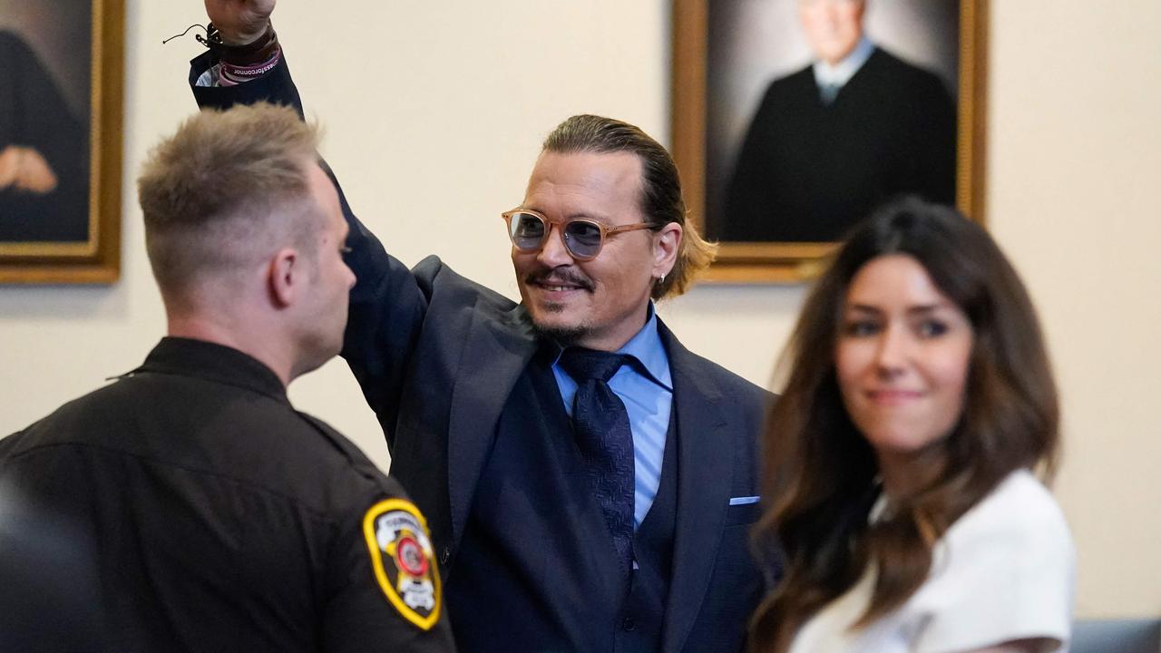 Johnny Depp gestures to spectators in court after closing arguments at Virginia’s Fairfax County Circuit Courthouse. Picture: Steve Helber/AFP