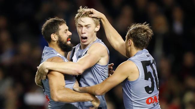 Paddy Ryder, Todd Marshall and Cam Sutcliffe celebrate another Power goal on Saturday. Picture: Michael Willson/AFL Photos via Getty Images