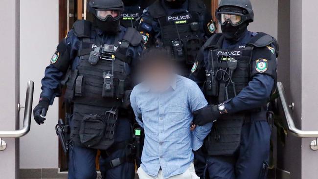 Quoc Kiem Tran is arrested during a raid on his Cabramatta home in June 2017. Picture: AFP