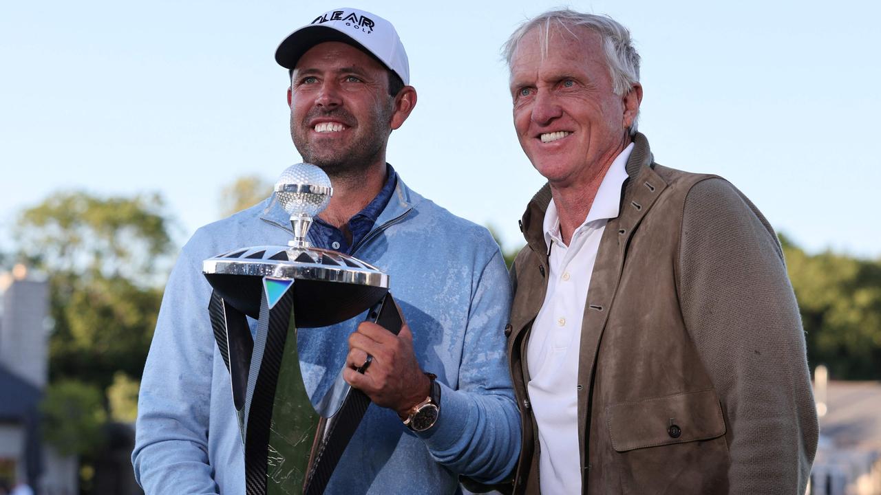 South African golfer Charl Schwartzel (left) with LIV Golf chief executive Greg Norman after winning at The Centurion Club in St Albans, north of London. Picture: Adrian Dennis/AFP