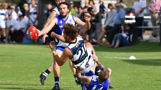 Mott gets a handball away against Port Noarlunga earlier this season. Picture: AAP/Keryn Stevens