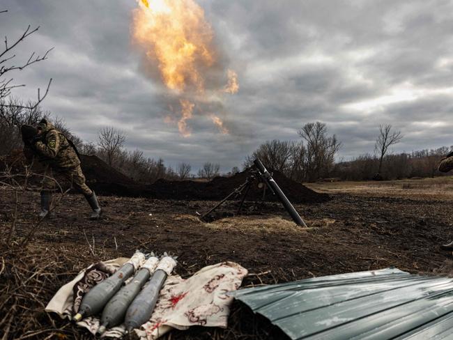 Ukrainian servicemen fire with a 120 mm mortar towards Russian positions on the outskirts of Bakhmut, eastern Ukraine on December 30, 2022. Picture: AFP