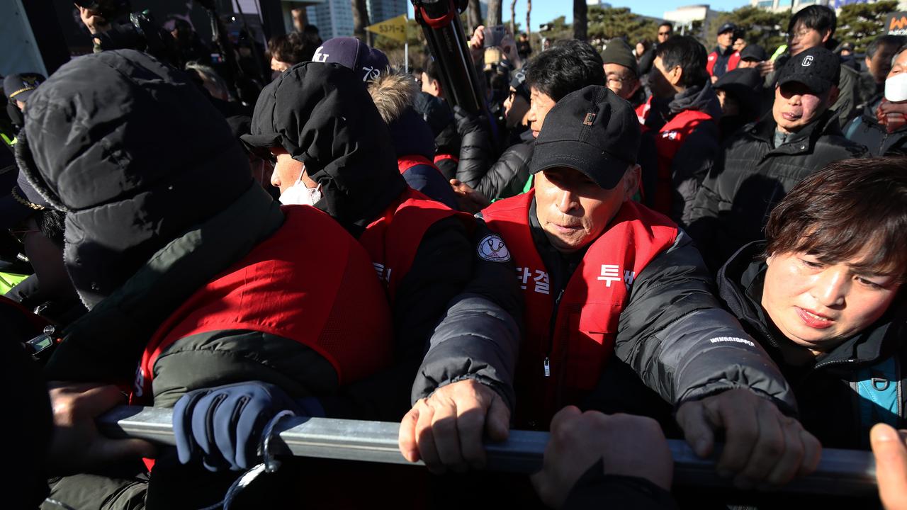 Dogs farmers scuffle with police officers during a protest, demanding the government scrap plans to pass a bill to enforce a ban on the consumption of dog meat, in front of Presidential office on November 30, 2023 in Seoul, South Korea. Picure: Getty Images