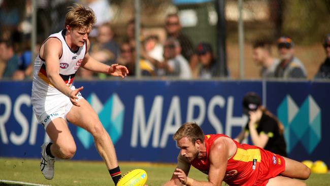 Fischer McAsey and Sam Day fight for the footy during their Marsh Series clash at Noarlunga Oval on Friday. Picture: Kelly Barnes (AAP)