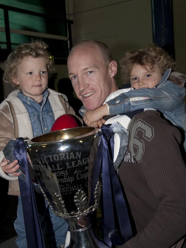 Abbie (right) clinging onto her dad Andrew McKay, with younger brother Charlie on the left. Picture: Supplied