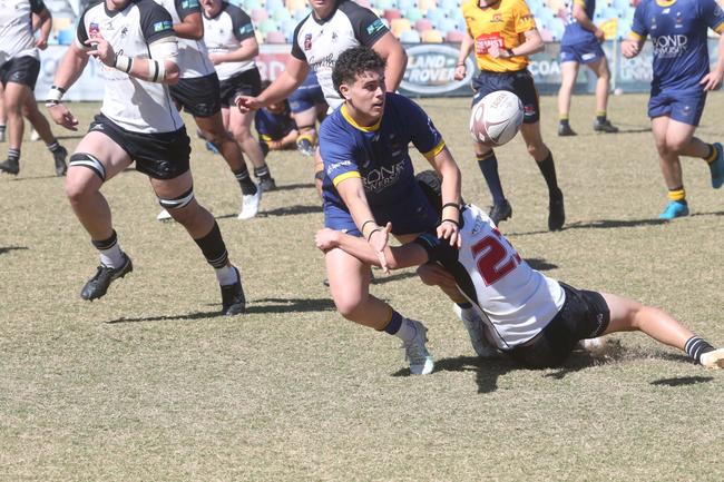 Callum Simpson gets an offload away. Picture by Richard Gosling