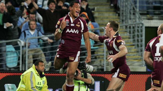 Israel Folau of the maroons jumps jumps in the air after scoring a try during the third game of the State of Origin series in Sydney on Wednesday, July 2, 2008. (AAP Image/Jenny Evans) NO ARCHIVING