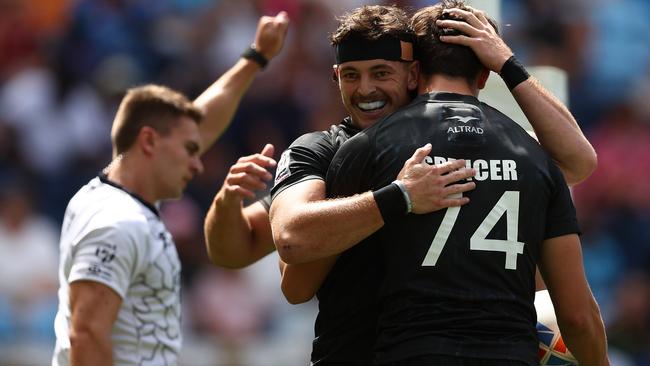 Payton Spencer celebrates with teammates after scoring a try against Uruguay. (Photo by Matt King/Getty Images)