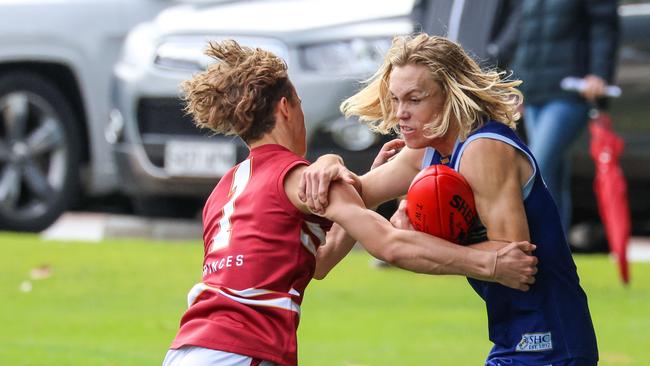 Kobe Ryan (right) in action for Sacred Heart during round one of the college footy season. Picture: Russell Millard