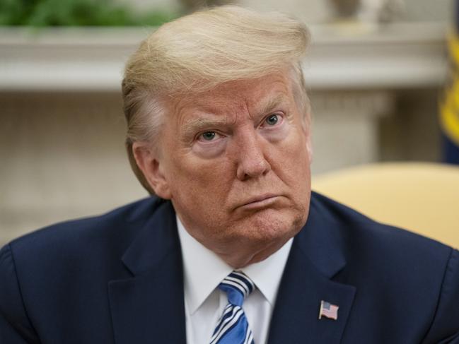 President Donald Trump listens during a meeting with Gov. Ron DeSantis, R-Fla., on the coronavirus response, in the Oval Office of the White House, Tuesday, April 28, 2020, in Washington. (AP Photo/Evan Vucci)