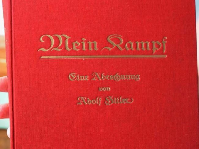 13/08/2009 WIRE: A copy of his infamous manifesto Mein Kampf signed by Adolf Hitler which was to be sold at Mullock's auctioneers at Ludlow, 124 miles (200 kilometers) northwest of London Thursday Aug. 13, 2009. The book signed by Hitler to a fellow inmate of Landsberg Prison in 1925. Mein Kampf outlines Hitler's anti-Semitic ideology. It was written in 1924, and was banned from publication in Germany after World War II. The book is expected to fetch 25,000 pounds ($41,500). (AP Photo/Barry Batchelor/PA) ** UNITED KINGDOM OUT NO SALES NO ARCHIVE **