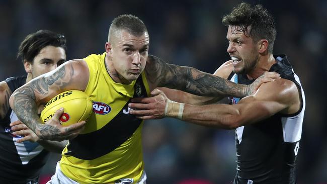 Dustin Martin tries to get past Travis Boak. Picture Sarah Reed