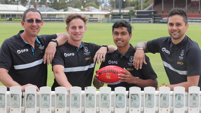 Daren and Jackson Mead with Trent and Peter Burgoyne at Alberton Oval. Picture: Russell Millard/AAP