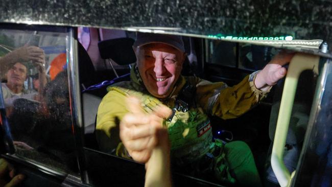 Prigozhin greeted crowds of supporters as he left Rostov-on-Don in an armoured vehicle last night. Picture: Reuters