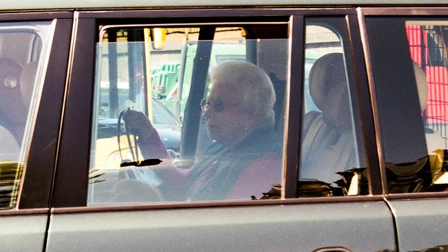 Queen Elizabeth II outside Buckingham Palace with Guy during royal wedding preparations. Picture: Getty