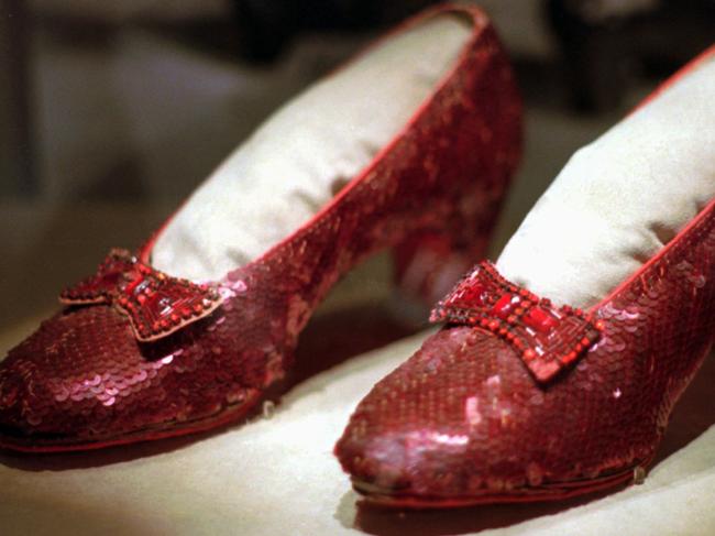 CORRECTS TO U.S. DOLLARS, NOT CANADIAN DOLLARS - FILE - This April 10, 1996 file photo shows one of the four pairs of ruby slippers worn by Judy Garland in the 1939 film "The Wizard of Oz" on display during a media tour of the "America's Smithsonian" traveling exhibition in Kansas City, Mo. An anonymous donor has offered a $1 million reward for credible information leading to a pair of the sequined shoes which was stolen from a museum in her Minnesota hometown, Grand Rapids. The 10-year anniversary of the theft is in August 2015. (AP Photo/Ed Zurga)