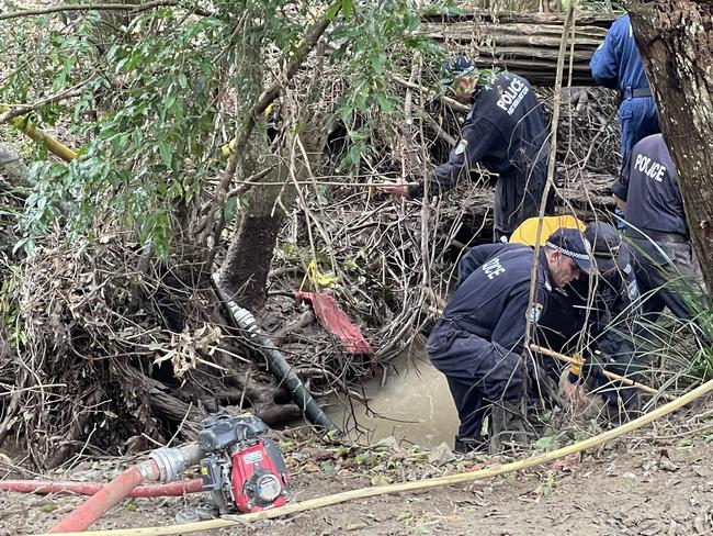 Investigators searching for the remains of William Tyrrell plucked a faded red piece of material from a drained creek on Monday. Picture: Supplied