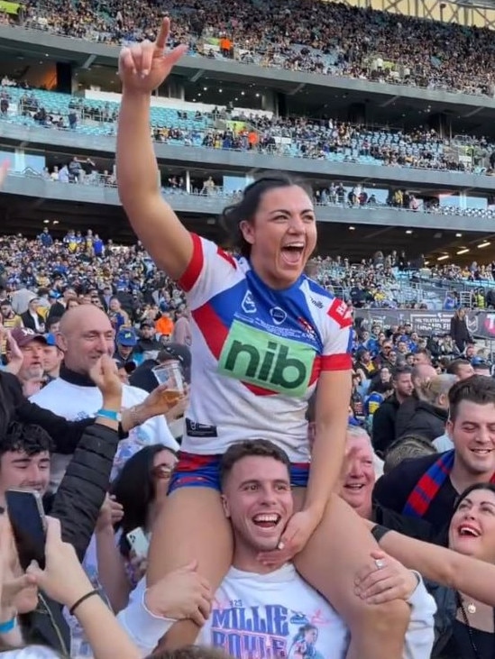 Adam Elliott celebrates Millie Boyle's premiership win.