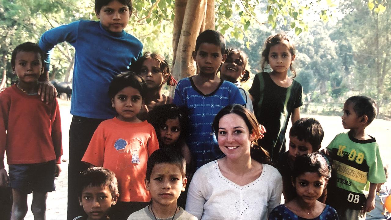 Rebecca Andrews with the children in the village.