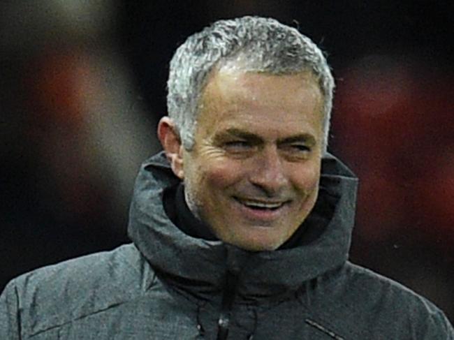 Manchester United's Portuguese manager Jose Mourinho laughs on the thouchline during the English Premier League football match between Manchester United and Manchester City at Old Trafford in Manchester, north west England, on December 10, 2017. / AFP PHOTO / Oli SCARFF / RESTRICTED TO EDITORIAL USE. No use with unauthorized audio, video, data, fixture lists, club/league logos or 'live' services. Online in-match use limited to 75 images, no video emulation. No use in betting, games or single club/league/player publications.  /