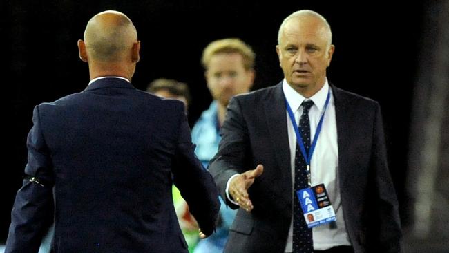 Graham Arnold (right) and Victory coach Kevin Muscat have had some robust discussions. Pic: AAP 