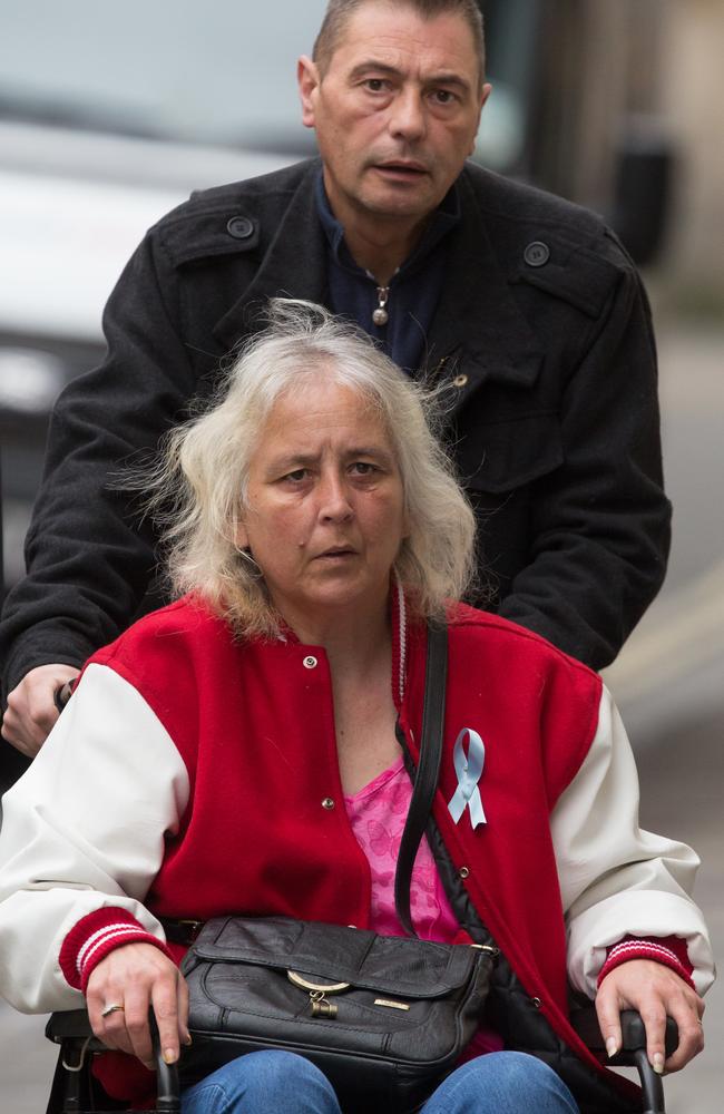 Stepmother of Becky Watts and mother of Nathan Matthews, Anjie Galsworthy, is pushed in her wheelchair by Becky Watts' father, Darren Galsworthy, as they arrive at Bristol Crown Court. Picture: Matt Cardy/Getty Images.