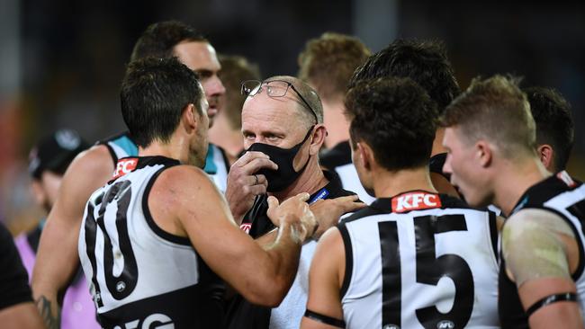 Searching for answers: Power coach Ken Hinkley speaks to Travis Boak during their defeat to Hawthorn. Picture: Getty