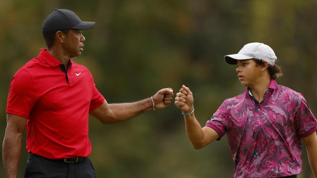 ORLANDO, FLORIDA - DECEMBER 17: Tiger Woods of the United States and son, Charlie Woods, react on the 15th green during the final round of the PNC Championship at The Ritz-Carlton Golf Club on December 17, 2023 in Orlando, Florida. (Photo by Mike Ehrmann/Getty Images)