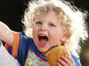 A new study suggests that eating cheeseburgers can reduce your life expectancy by a few minutes each time. Pictured is Scout Parker, 2 and his brother Courtland, 4, enjoying a cheeseburger. Picture: David Swift