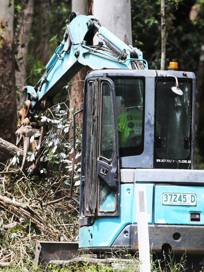 Equipment is used to clear foliage. Picture: Peter Lorimer