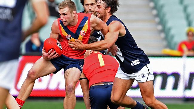 South Australia’s Andrew Bradley tries to break the tackle of Victoria’s Willie Wheeler in the last SANFL-VFL clash at Adelaide Oval in 2016. Picture: Tom Huntley