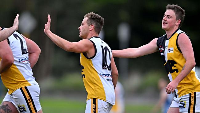 Chirnside Park’s Josh Clavan celebrates a goal with teammates. Picture: Andy Brownbill