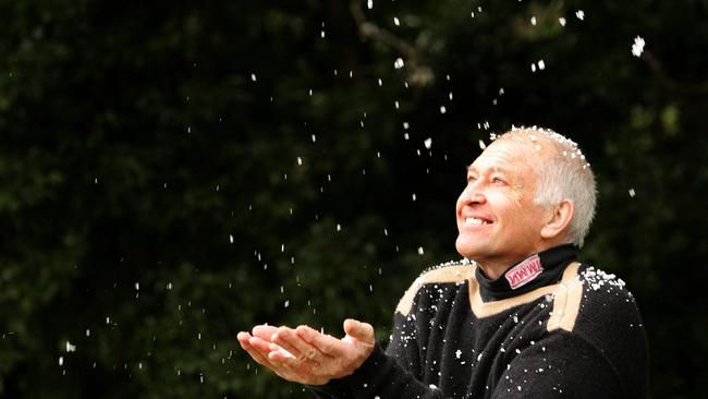 Ken Tie plays with the last icy remains at the Repeater Station, Springbrook Mountain in 2005. Picture: Donna Cosford