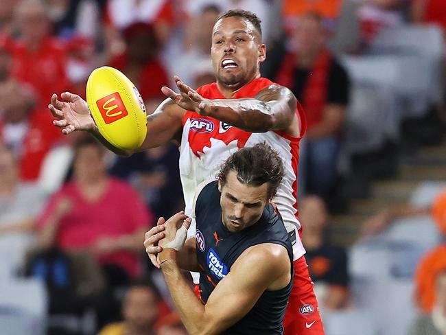 Lance Franklin leaps over Phil Davis in round 1. Picture: Mark Kolbe/Getty Images