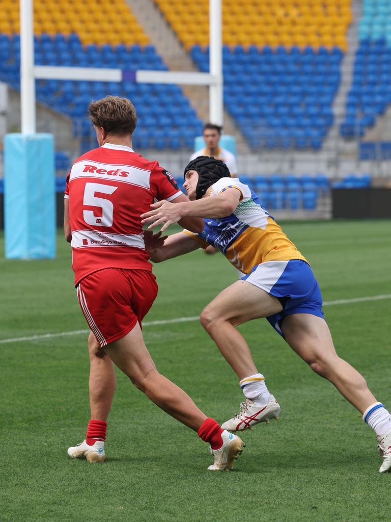 NRL National Schoolboys Cup final at CBUS Stadium between Palm Beach Currumbin and Patrician Blacktown Brothers. The Red Army and Palm Beach Currumbin 's Beau Hartmann scores the winning try and celebrates with team mates.. .Picture Glenn Hampson