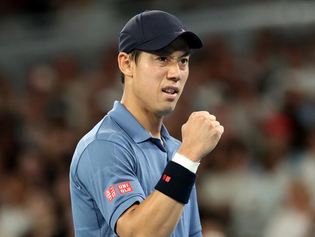 MELBOURNE, AUSTRALIA - JANUARY 12: Kei Nishikori of Japan celebrates a point against Thiago Monteiro of Brazil in the Men's Singles First Round during day one of the 2025 Australian Open at Melbourne Park on January 12, 2025 in Melbourne, Australia. (Photo by Kelly Defina/Getty Images)