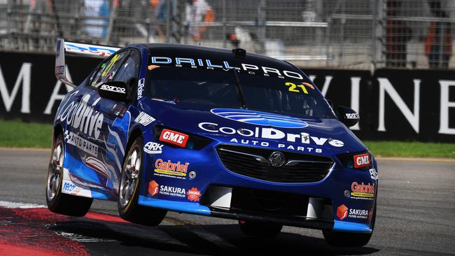 In better shape... Jones’ car whizzing around the course on Thursday. Picture: Getty