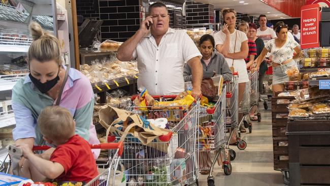 Shoppers queue in a Cairns Coles ahead of a lockdown. Picture: Brian Cassey