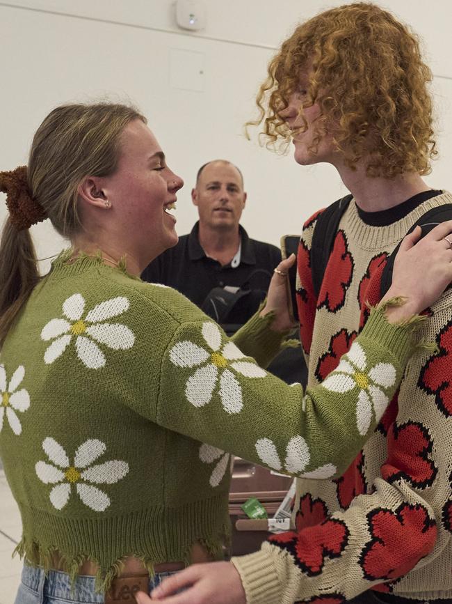 Mia Parker greets her brother Kane at Adelaide Airport. Picture: Matt Loxton