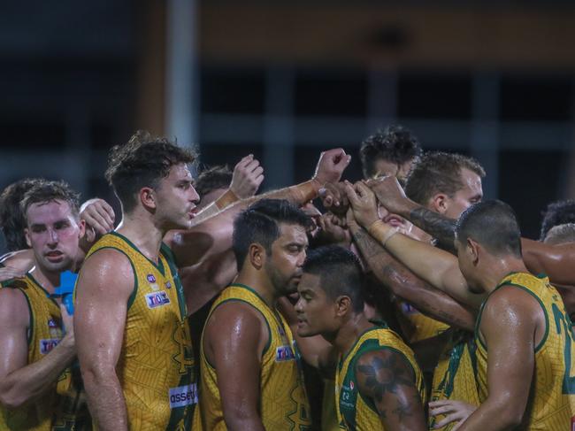 St Mary’s players pictured gathering and motivating each other before their 2020-21 NTFL Men's Preliminary Final against Wanderers last Saturday night. The Saints won by 27 points, an incredible result given the turmoil the club went through in the week leading up to the game. Picture: Glenn Campbell