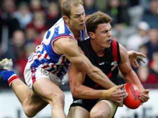 Steve Kretiuk and Matthew Lloyd do battle in 2003. Picture: Colleen Petch 