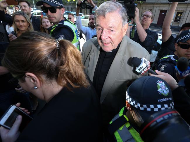 Cardinal George Pell (C) makes his way through members of the media to the court in Melbourne on February 27, 2019. - Cardinal George Pell arrived in court, possibly for the last time as a free man, in a last-ditch push to apply for bail after his historic conviction for child sex crimes. (Photo by ASANKA BRENDON RATNAYAKE / AFP)