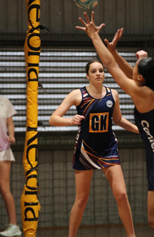 Netball action at QISSN 2024. Canterbury College v Good Shepherd Lutheran College