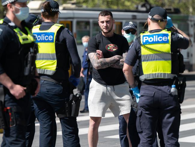 Police randomly check permits near the Melbourne Convention Centre. Picture: Tony Gough