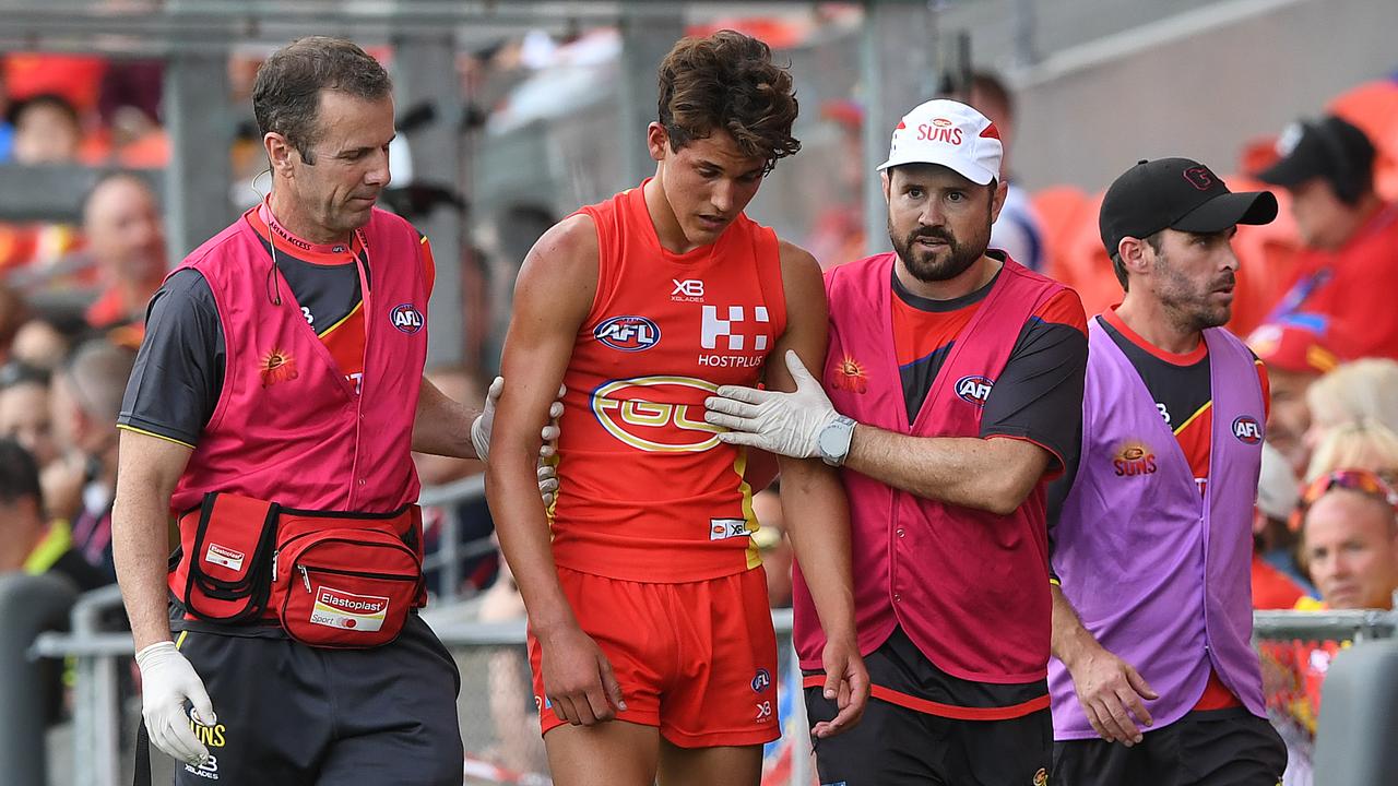 The Suns’ Will Powell is taken from the field with concussion. Picture: AAP Image/Dave Hunt