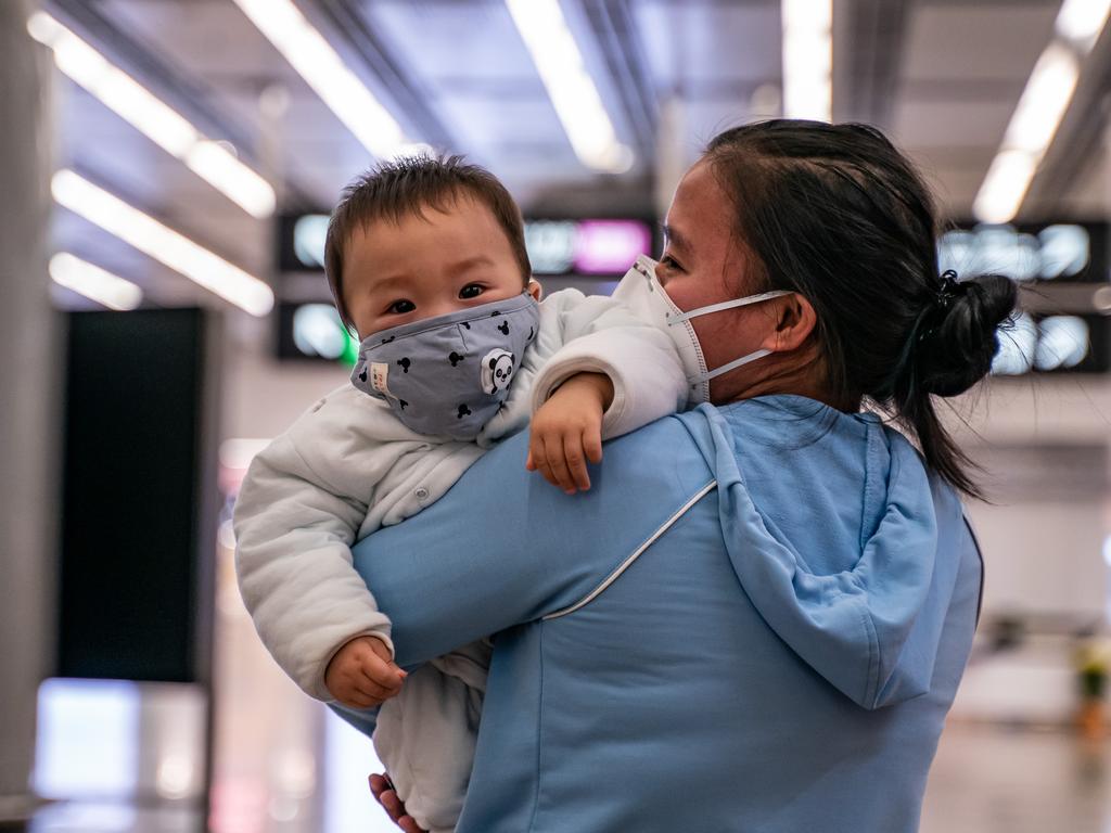 A woman and baby wear masks at Hong Kong High Speed Rail Station on January 29. Picture: Anthony Kwan/Getty Images